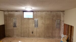 Before photo of basement remodel after foundation repairs.