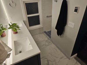 Master Suite vanity with schluter ditra heat tile floor.