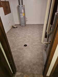 Laundry room after new sheet vinyl flooring.