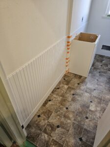 wainscot installation in bathroom.