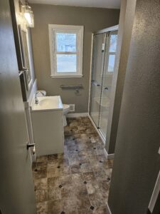Bathroom remodel with wainscot and sheet vinyl