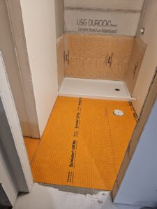 Bathroom with schluter ditra and kerdi waterproofing.